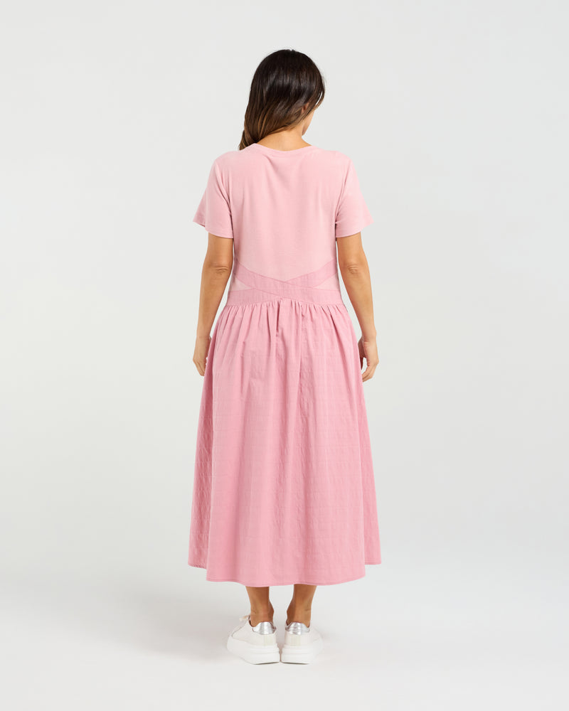 Woman wearing a pink dress on a white background
Delilah Dress Pink
