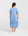 Woman wearing a blue dress on a white background Selena Dress Blue