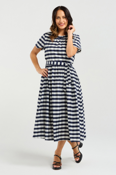 Woman wearing a black and white striped dress on a white background
Scarlett Dress Navy Check