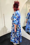 Person wearing a blue floral dress standing in front of a mirror.
Sher Dress Blue