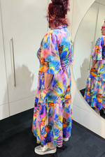 Person wearing a colorful dress in front of a mirror
Sher Dress Purple