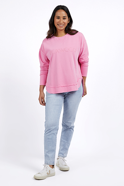 Woman wearing a pink sweater and light blue jeans on a white background
Simplified Crew Bubblegum Pink