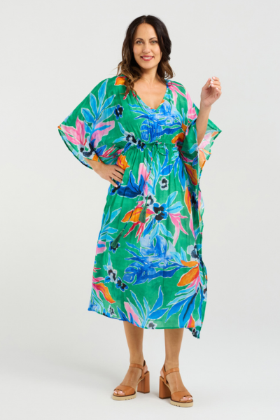 Woman wearing a colorful floral dress on a white background Sonya Dress Jungle