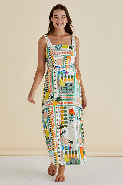 Woman wearing a colorful patterned dress against a beige background Tegan Midi Dress Paradise Print