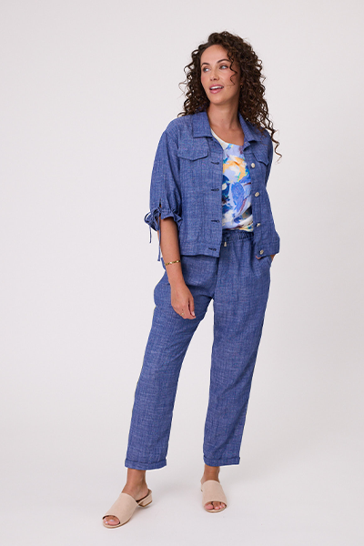 Woman wearing a blue denim outfit with a white background Venice Linen Jacket Denim