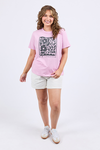 Woman wearing a pink t-shirt with a graphic design on a white background
Winona Tee Dusk Pink