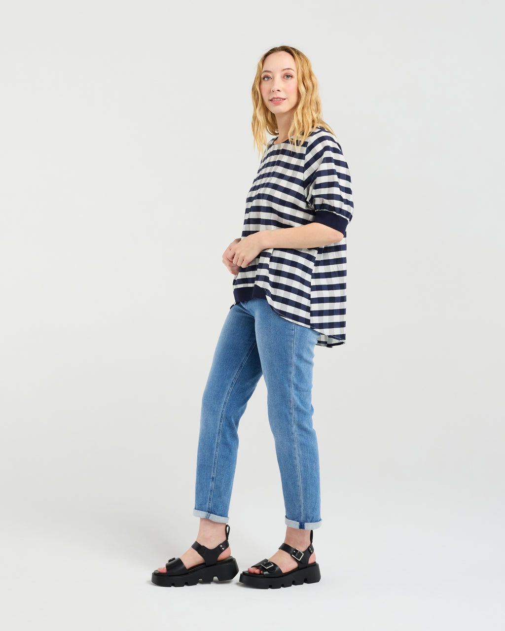 Woman wearing a striped shirt and jeans on a white background
Havana Top Navy Check