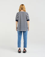 Person wearing a striped shirt and jeans from behind on a white background
Havana Top Navy Check