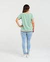 Person wearing a light green t-shirt and light blue jeans on a white background
Mia T-Shirt Mint