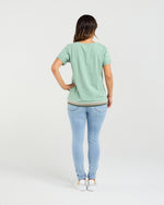 Person wearing a light green t-shirt and light blue jeans on a white background
Mia T-Shirt Mint