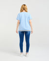 Person wearing a light blue t-shirt and blue jeans on a white background
Mia T-Shirt Blue