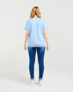 Person wearing a light blue t-shirt and blue jeans on a white background
Mia T-Shirt Blue