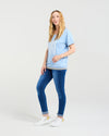 Woman wearing a light blue t-shirt and blue jeans on a white background
Mia T-Shirt Blue