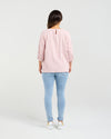Person wearing a pink checkered shirt and light blue jeans on a white background
Hazel Top Pink Check