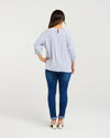Woman wearing a blue checkered shirt and blue jeans on a white background
Hazel Top Blue Check