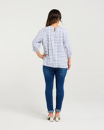 Woman wearing a blue checkered shirt and blue jeans on a white background
Hazel Top Blue Check