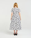 Woman wearing a floral dress on a white background
Scarlett Dress Floraline