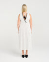Woman wearing a white striped dress with black trim on a plain background
Zariah Dress Pinstripe