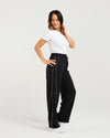 Woman wearing black high-waisted pants with white trim on a light gray background
Polly Pants Black