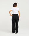 Person wearing black pants and a white shirt on a light gray background
Polly Pants Black