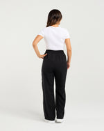 Person wearing black pants and a white shirt on a light gray background
Polly Pants Black