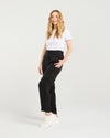 Woman wearing a white t-shirt and black pants on a plain background
Lilith Pants Black