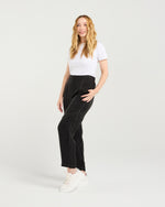 Woman wearing a white t-shirt and black pants on a plain background
Lilith Pants Black