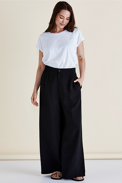 Woman wearing a white t-shirt and black wide-leg pants against a beige background
Zander Pants Black