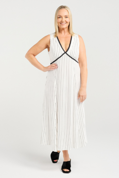Woman wearing a white dress with black stripes on a white background
Zariah Dress Pinstripe