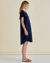 Woman wearing a navy blue dress against a beige background
Sydney Tee Dress Navy