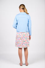 Person wearing a light blue denim jacket and a colorful floral skirt on a white background
Frayed Linen Jacket Sky Blue