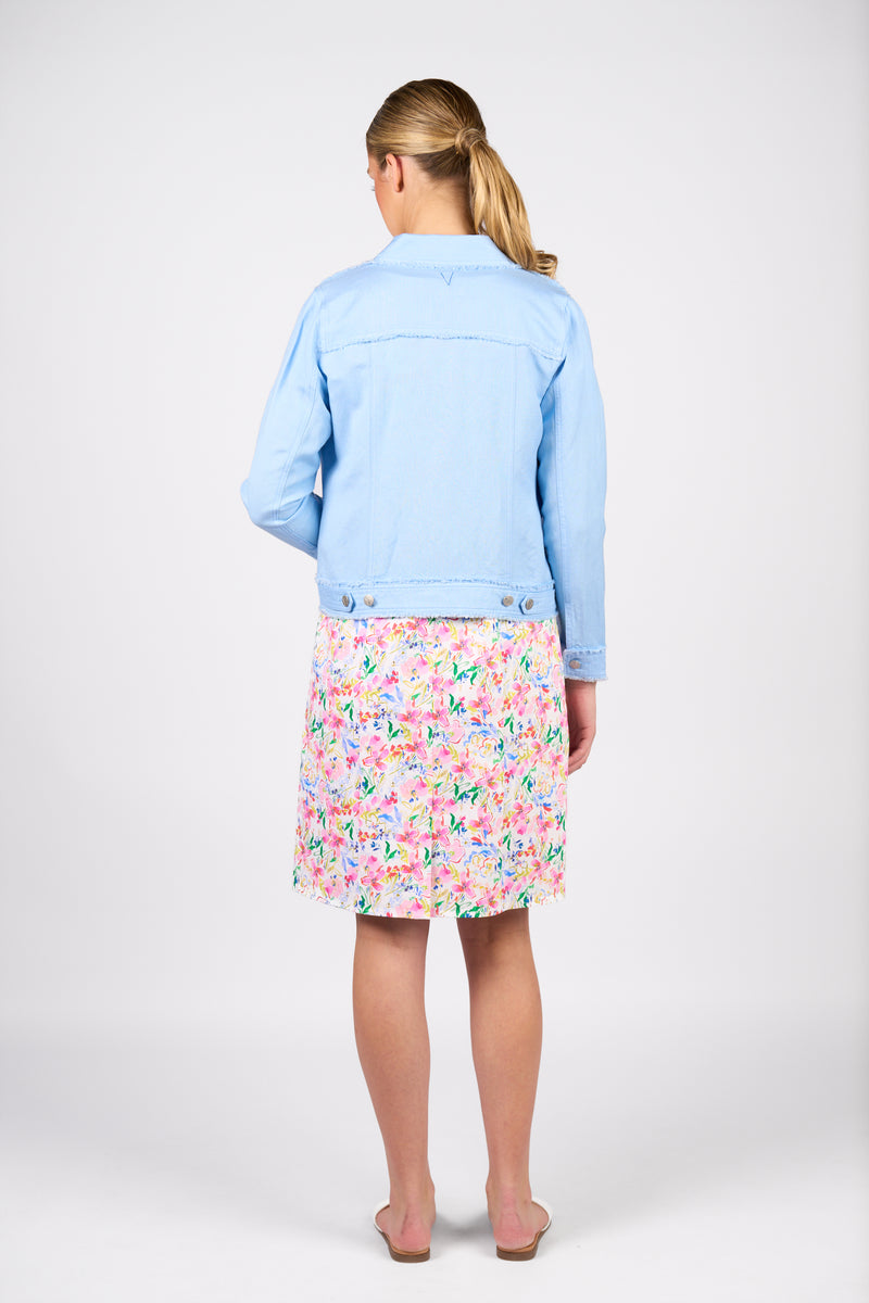 Person wearing a light blue denim jacket and a colorful floral skirt on a white background
Frayed Linen Jacket Sky Blue