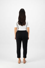Woman wearing a white top and black pants on a white background
Skinny Leg 7/8 Pants Black