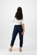 Person wearing navy pants and a white shirt on a white background
Skinny Leg 7/8 Pants Ink