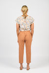 Woman wearing a floral blouse and orange pants on a white background
Skinny Leg 7/8 Pants Spice