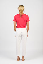 Person wearing a red shirt and white pants on a white background
Skinny Leg 7/8 Pants White