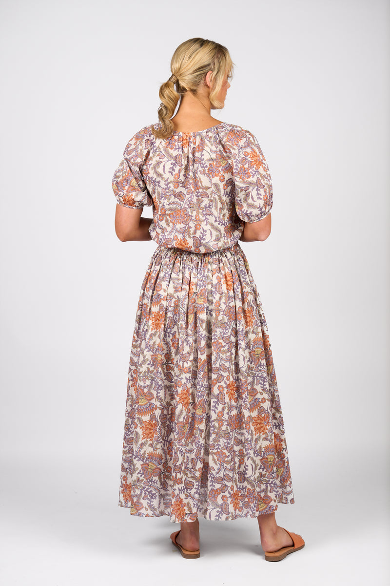 Woman wearing a floral dress on a white background
Elastic Waist Maxi Skirt Tuscany